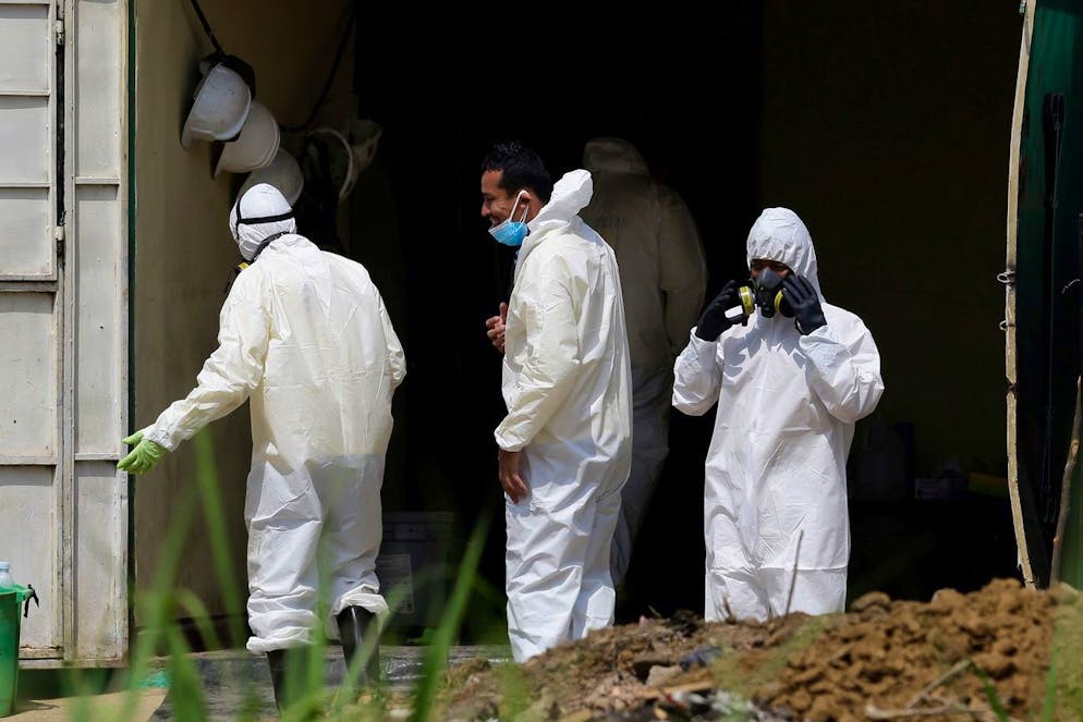 epa09217672 Forensic teams, members of the Attorney General's Office, and police officers work during a search for human remains at the house of former police officer Hugo Ernesto Osorio, who is being investigated for homicide, in Chalchuapa, northwest of San Salvador, El Salvador, 20 May 2021 (issued 21 May 2021). EPA/RODRIGO SURA