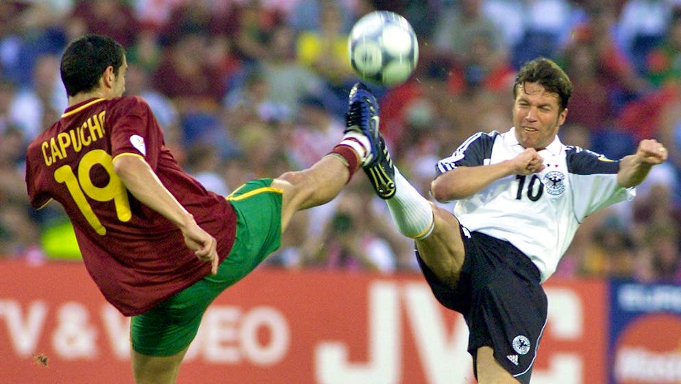 RTD106-20000620-ROTTERDAM; NETHERLANDS: German player Lothar Matthaeus (r) fights for the ball with Capucho (l) of Portugal during the Euro 2000 soccer championships match Portugal vs Germany in Rotterdam, Tuesday 20 June 2000. (ELECTRONIC IMAGE) EPA PHOTO EPA/ED OUDENAARDEN