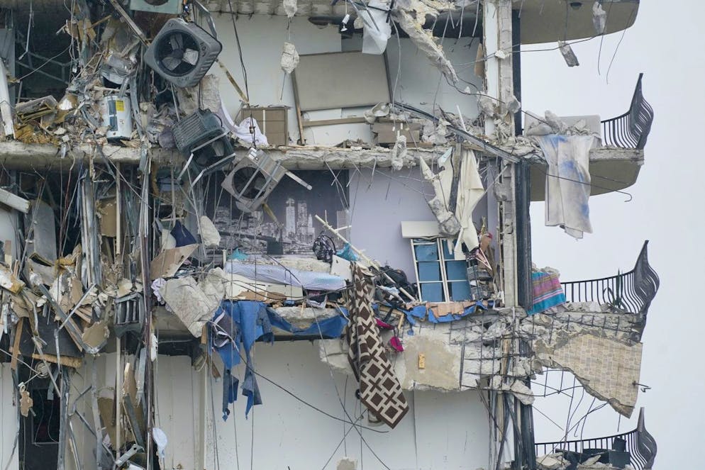 Part of a building is shown after a partial collapse, Thursday, June 24, 2021, in Surfside, Fla. A wing of a 12-story beachfront condo building collapsed with a roar in a town outside Miami early Thursday, trapping residents in rubble and twisted metal. (AP Photo/Wilfredo Lee)