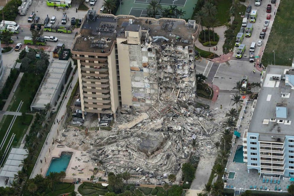 This aerial photo shows part of the 12-story oceanfront Champlain Towers South Condo that collapsed early Thursday, June 24, 2021 in Surfside, Fla. (Amy Beth Bennett/South Florida Sun-Sentinel via AP)