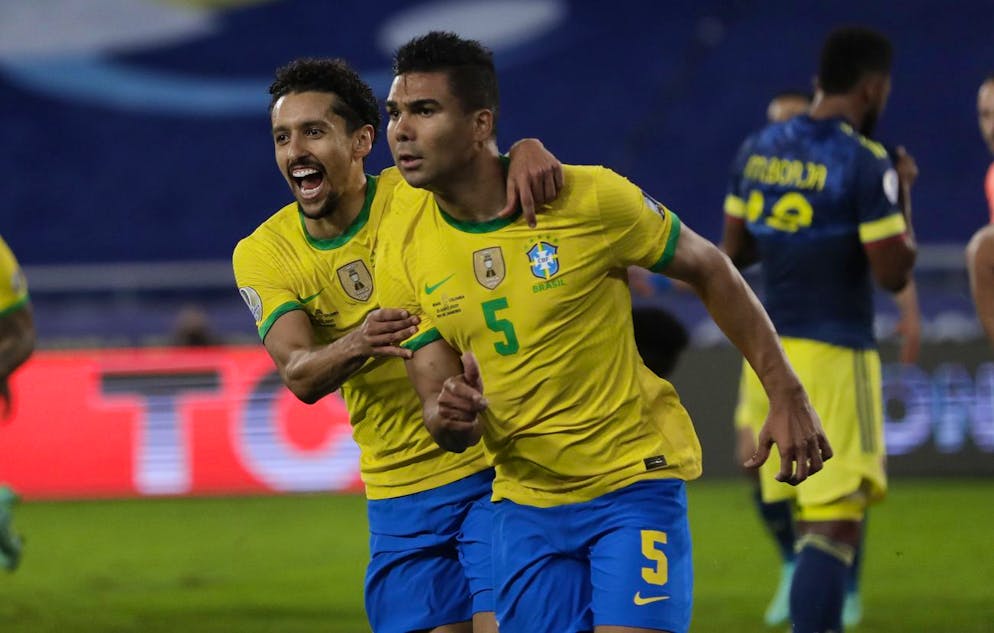 Brazil's Casemiro, right, celebrates with teammate Marquinhos after scoring his side's 2nd goal against Colombia during a Copa America soccer match at Nilton Santos stadium in Rio de Janeiro, Brazil, Wednesday, June 23, 2021. (AP Photo/Silvia Izquierdo)