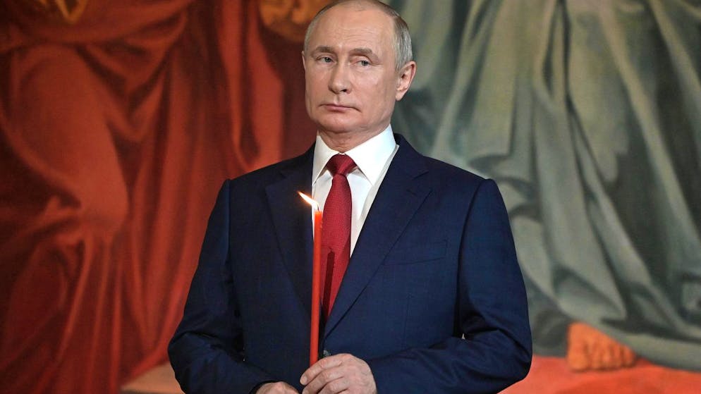 Russian President Vladimir Putin attends the Easter service in the Christ the Savior Cathedral in Moscow, Russia, Sunday, May 2, 2021. Eastern Orthodox churches observe the ancient Julian calendar, and this year celebrate the Orthodox Easter on May 2. (Sergei Guneyev, Sputnik, Kremlin Pool Photo via AP)