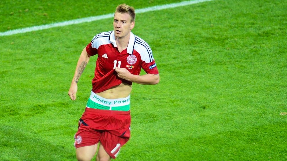 Nicklas Bendtner of Denmark celebrates after scoring the 2-2 equalizer during the Group B preliminary round match of the UEFA EURO 2012 between Denmark and Portugal in Lviv, Ukraine, 13 June 2012. UEFA opened proceedings Friday June 15th against Denmark striker Nicklas Bendtner for revealing the name of an Irish bookmaker on his underpants while celebrating a goal in the Euro 2012 match against Portugal. European football's organizing body said Bendter was being charged for