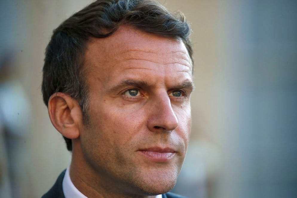French President Emmanuel Macron listens to Libyan Prime Minister Abdulhamid Dbeibeh during a press conference after their meeting at the Elysee Palace in Paris, Tuesday, June 1, 2021. (AP Photo/Francois Mori)