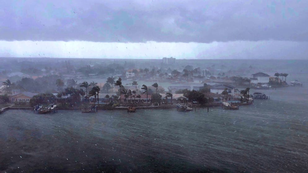 Looking north at the neighborhood of Paradise Island on Treasure Island, Fla., outer bands of Tropical Storm Elsa brings a downpour of rain over the area on Tuesday afternoon, July 6, 2021. Elsa is expected to impact the Tampa Bay area the heaviest during the predawn hours of Wednesday morning. (Marc Topkin/Tampa Bay Times via AP)