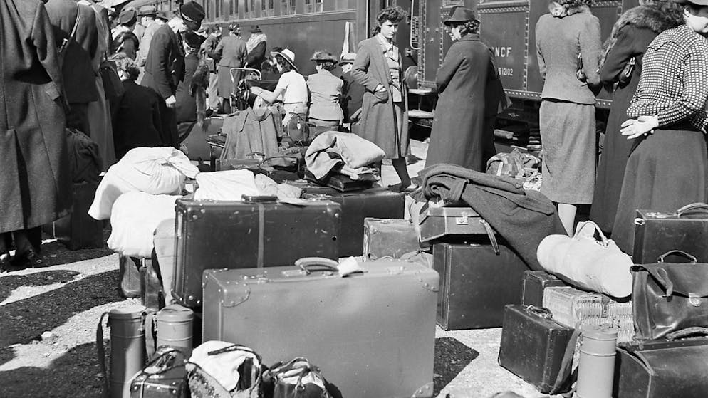 Des Suisses sans emploi en partance pour le Brésil, vers 1930.