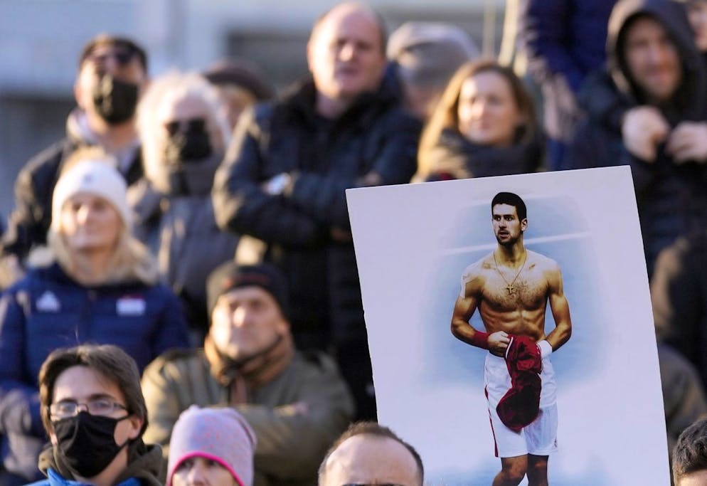 Supporters of Serbia's Novak Djokovic protest in Belgrade, Serbia, Friday, Jan. 7, 2022. Several hundred people gathered outside Serbian parliament in a show of support for Serbian tennis player Novak Djokovic as he battles the Australian legal system in an attempt to be allowed to stay in the country and compete in the Australian Open later this month. (AP Photo/Darko Vojinovic)