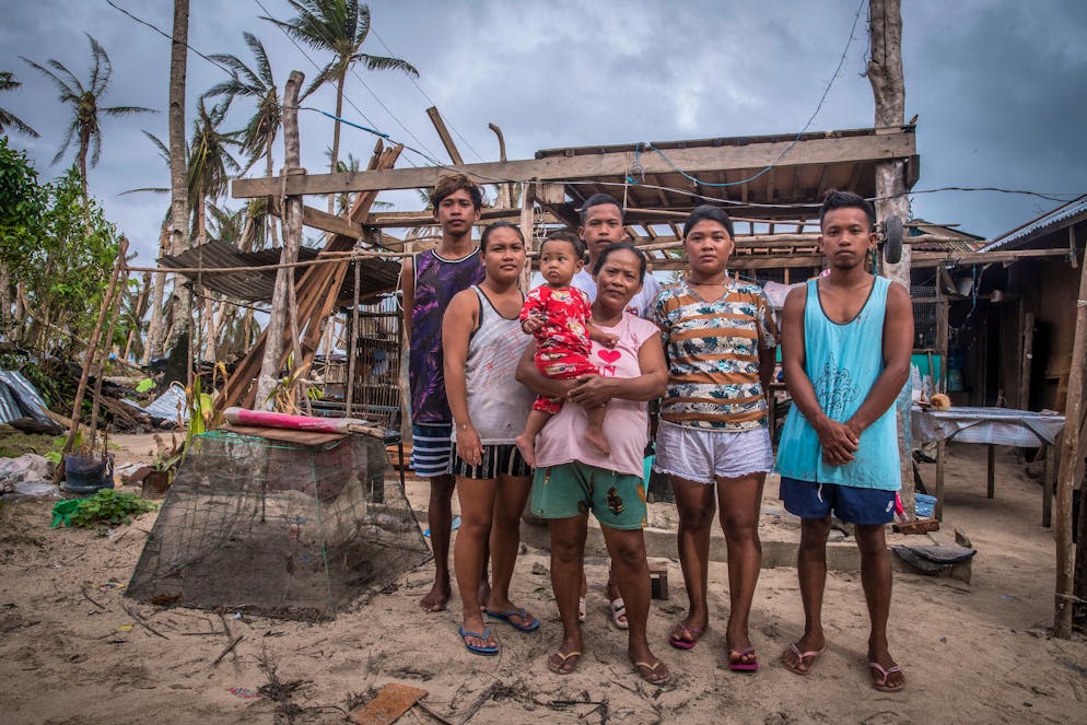 Charlo Eliot, 25 years old (right side, blue shirt) and his family of 7 live under the same roof. Within only some hours they've lost their livelihood completely. Both, house and boat are destroyed. They will get temporary assistance of food from the village (Barangay). If there is no assistance available, they tend to borrow money from neighbors and other relatives, it's also comon to ask for credit (utang) in local grocery (sari-sari store). Fishing depends on the weather. If there is enough catch they feed themselves first and sell surplus in the market of General Luna.