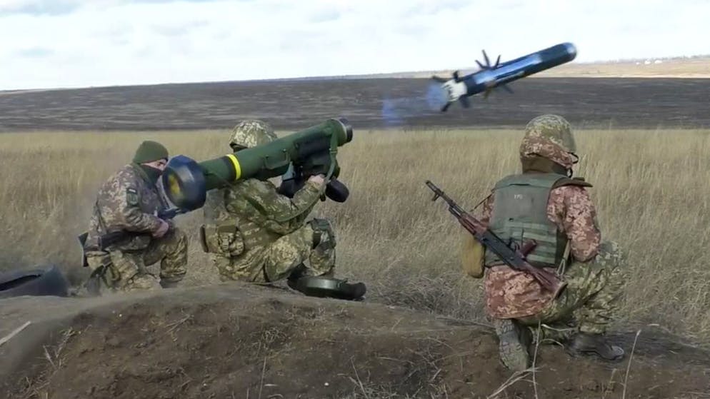 In this image taken from footage provided by the Ukrainian Defense Ministry Press Service, a Ukrainian soldiers use a launcher with US Javelin missiles during military exercises in Donetsk region, Ukraine, Wednesday, Jan. 12, 2022. President Joe Biden has warned Russia's Vladimir Putin that the U.S. could impose new sanctions against Russia if it takes further military action against Ukraine. (Ukrainian Defense Ministry Press Service via AP)