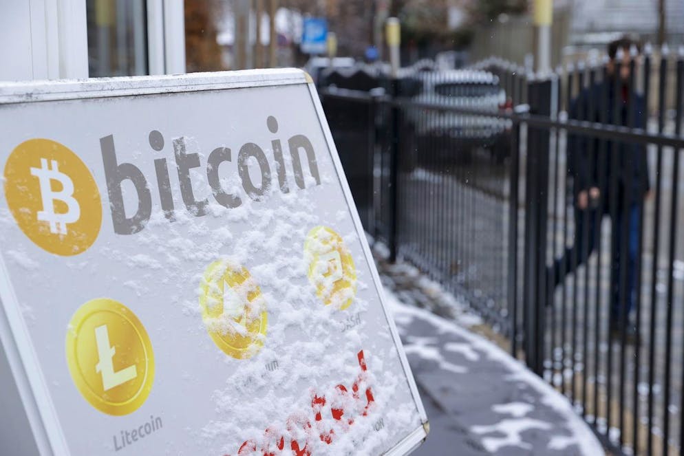 epa09677138 A Bitcoin sign is placed in front of a crypto exchange office in Pristina, Kosovo, 10 January 2022. Kosovo's government has banned cryptocurrency mining as emergency measure on 24 December 2021 to restrict the energy supply, valid for a maximum of 60 days. In October 2021, Kosovo announced it had drafted a law on cryptocurrency which parliament was expected to adopt by the end of the last year, but the regulation is still pending. EPA/VALDRIN XHEMAJ