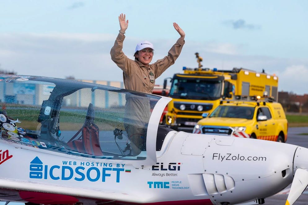 epa09696972 Belgian-British pilot Zara Rutherford waves after landing in Wevelgem, Belgium, 20 January 2022. Zara, 19, broke the Guinness World Record for being the youngest person to fly solo around the world in a microlight aircraft Her journey began in August 2021 in a Shark Aero ultralight aircraft departing from Belgium and heading west. EPA/STEPHANIE LECOCQ