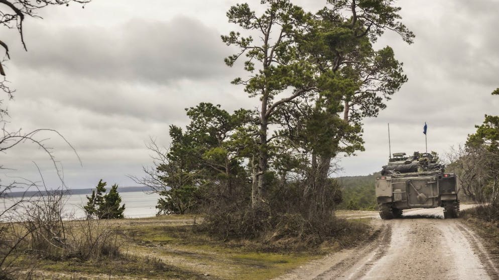 epa09689912 16 January 2022 Swedish soldiers of the Kotlands Regiment patrol the roads in North Gotland, Sweden in armored vehicles.  Sweden is said to have increased their military presence in the Gotland region. 