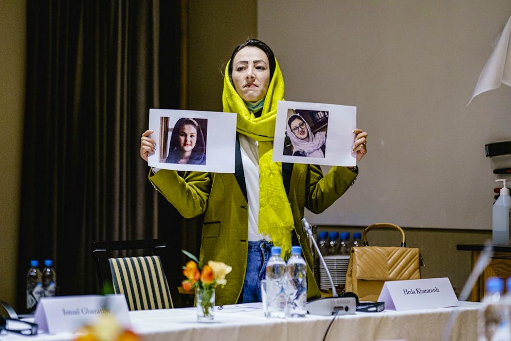 Delegate from the Afghan civil society Heda Khamoush holds up photos of two women who have vanished, ahead of a meeting, in Oslo, Norway, Monday, Jan. 24, 2022. Western diplomats are meeting with Afghan womenâÄ™s rights activists and human rights defenders in Oslo ahead of the first official talks with the Taliban in Europe since the Taliban took over in August. The closed-door meeting was a chance to hear from civil society in Afghanistan and the Afghan diaspora their demands and assessment of the current situation on the ground. The meeting was taking place at a hotel in the snow-capped mountains above the Norwegian capital and was attended by representatives of the EU, the US, the United States, France, Italy and hosts Norway. (Stian Lysberg Solum / NTB via AP)