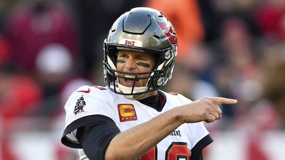 Tampa Bay Buccaneers quarterback Tom Brady (12) calls a play against the Los Angeles Rams during the second half of an NFL divisional round playoff football game Sunday, Jan. 23, 2022, in Tampa, Fla. (AP Photo/Jason Behnken)