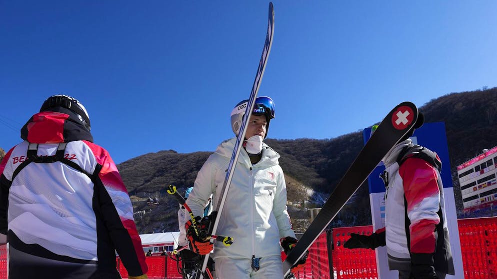 Marco Odermatt, of Switzerland leaves the finish area at the bottom of the course after men's downhill training was cancelled at the 2022 Winter Olympics, Saturday, Feb. 5, 2022, in the Yanqing district of Beijing. The final men's downhill training was cancelled after only three skiers completed the course due to high winds. (AP Photo/Luca Bruno)