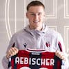 Swiss midfielder Michel Aebischer, on loan to Bologna from Young Boys, poses with his new shirt during his presentation at Bologna headquarters, Italy, Wednesday, Jan. 26, 2022. (Guido Calamosca/LaPresse via AP)