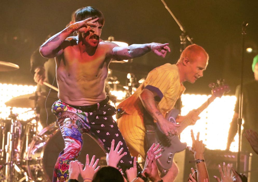 Anthony Kiedis, left, and Flea, of Red Hot Chili Peppers, perform a medley at the 61st annual Grammy Awards on Sunday, Feb. 10, 2019, in Los Angeles. (Photo by Matt Sayles/Invision/AP)