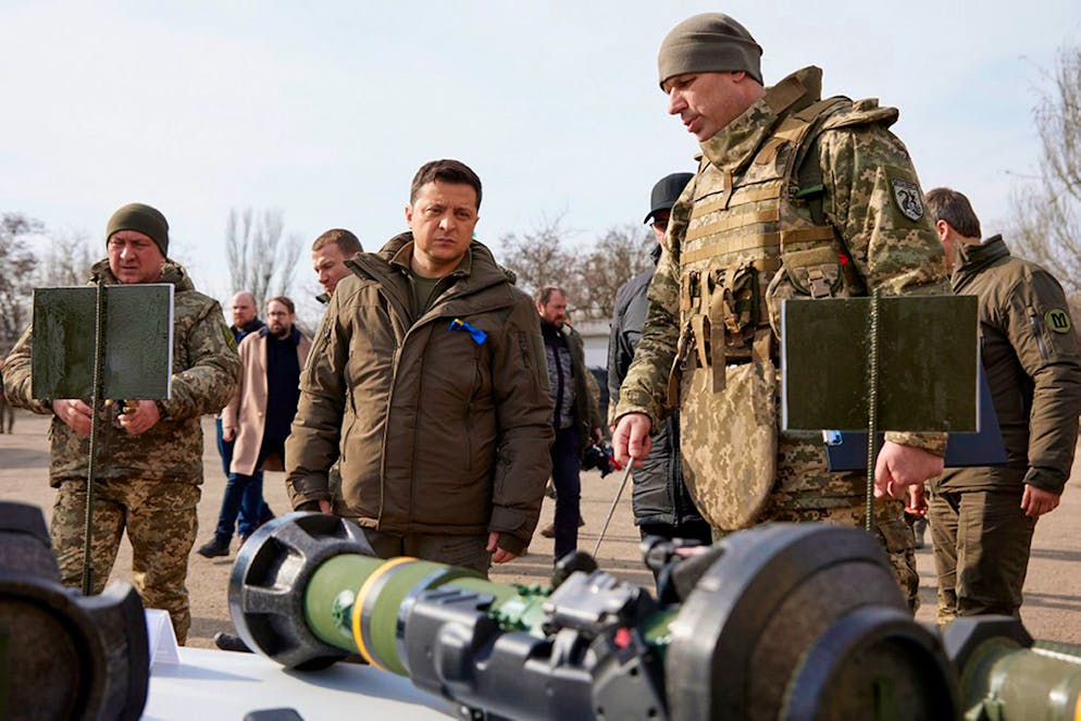 In this handout photo provided by the Ukrainian Presidential Press Office, Ukrainian President Volodymyr Zelenskyy, center, inspects weapons during a visit to Ukrainian coast guards in Mariupol, Donetsk region, eastern Ukraine, Thursday, Feb. 17, 2022. U.S. Secretary of State Antony Blinken told ABC News that Russian President Vladimir Putin