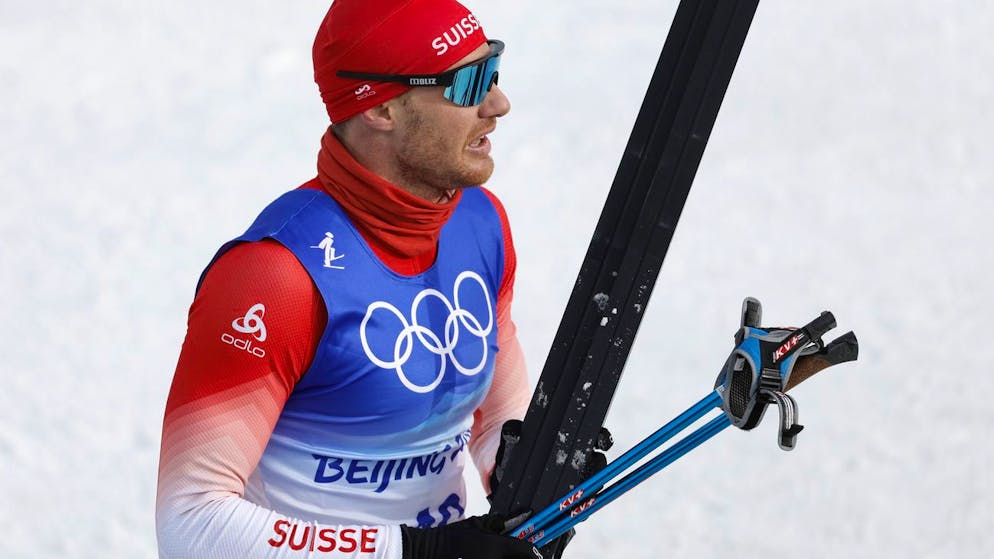 Dario Cologna of Switzerland reacts in the finish area during the men's 15km classic cross-country skiing competition at the 2022 Winter Olympics in Zhangjiakou, China, on Friday, Feb. 11, 2022. (KEYSTONE/Peter Klaunzer)..