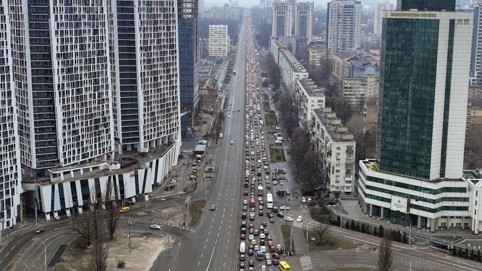 Traffic jams are seen as people leave the city of Kyiv, Ukraine, Thursday, Feb. 24, 2022. Russian President Vladimir Putin on Thursday announced a military operation in Ukraine and warned other countries that any attempt to interfere with the Russian action would lead to 