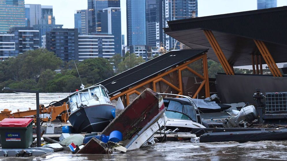 epa09790180 Boats and other debris are washed into the Milton ferry terminal in Brisbane, Australia, 28 February 2022. The state of Queensland's southeast is set to endure more wild weather as the state grapples with a days-long flood crisis. EPA/DARREN ENGLAND AUSTRALIA AND NEW ZEALAND OUT