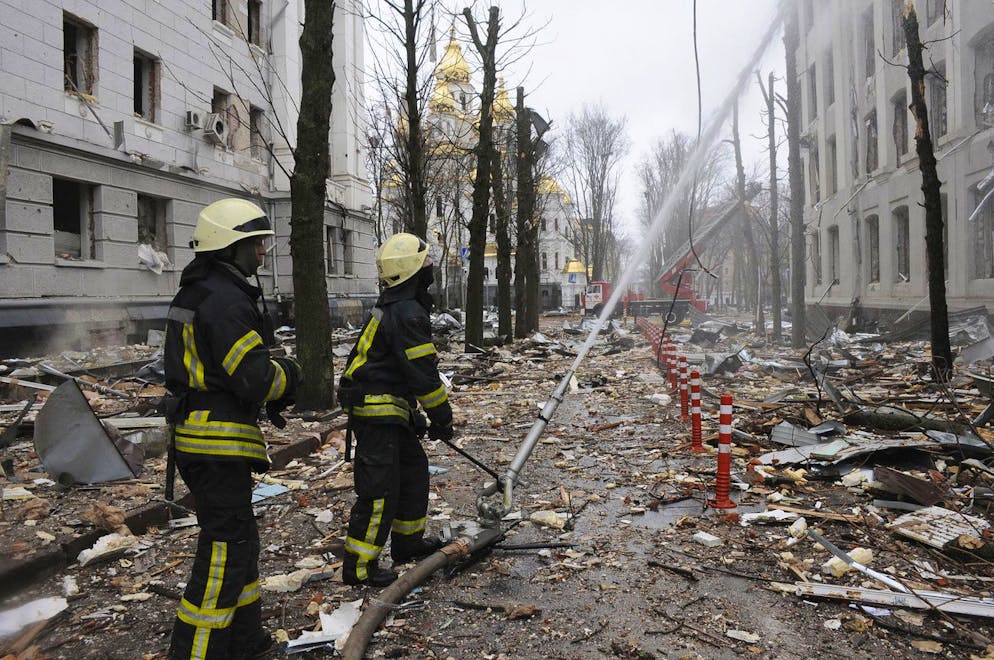Firefighters extinguish a building of Ukrainian Security Service (SBU) after a rocket attack in Kharkiv, Ukraine's second-largest city, Ukraine, Wednesday, March 2, 2022. Russia's assault on Kharkiv, Ukraine's second largest city, continued Wednesday, with a Russian strike hitting the regional police and intelligence headquarters, according to the Ukrainian state emergency service. (AP Photo/Andrew Marienko)