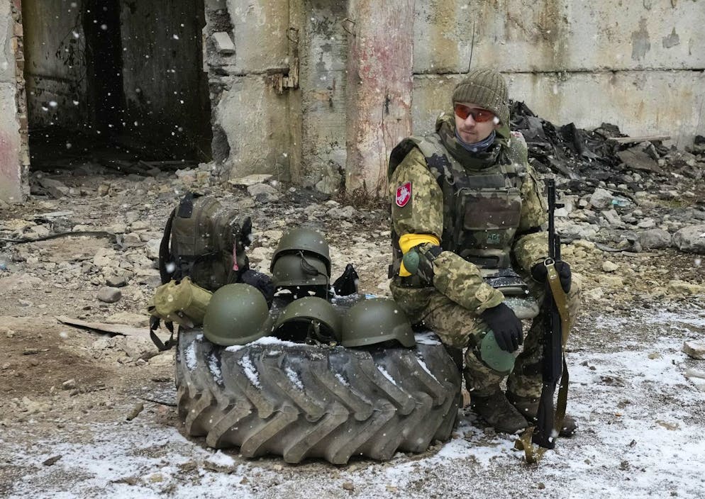 A Belarusian volunteer rests after military training at the Belarusian Company base in Kyiv, Ukraine, Tuesday, March 8, 2022. Hundreds of Belarus' emigrants and citizens have arrived in Ukraine to help the Ukrainian army fight against Russian invaders. (AP Photo/Efrem Lukatsky)