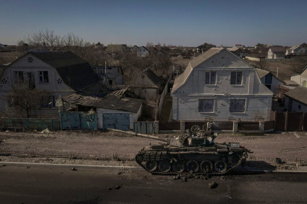 A destroyed tank is seen after battles between Ukrainian and Russian forces on a main road near Brovary, north of Kyiv, Ukraine, Thursday, March 10, 2022. (AP Photo/Felipe Dana)