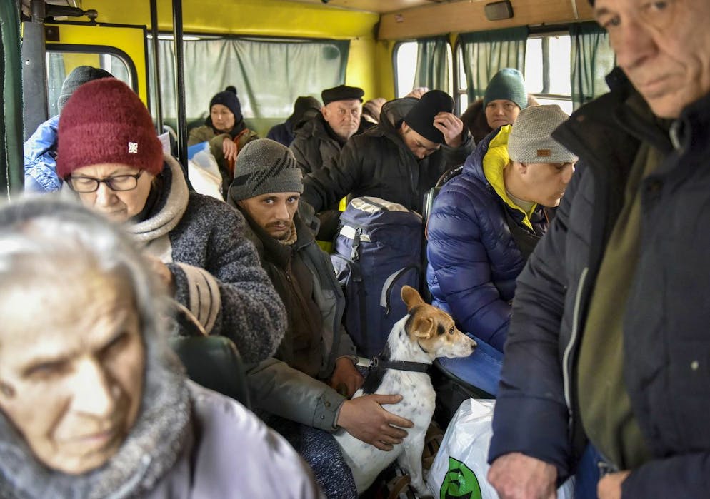 epa09819463 People who were evacuated from the cities of Irpin, Vorzel, Gostomel, and other places under attack near of Ukrainian capital sit on a bus during their next part of their trip to the West in Kyiv (Kiev), Ukraine, 12 March 2022. The buildings and infrastructures of that cities are totally destroyed. Russian troops entered Ukraine on 24 February prompting the country's president to declare martial law and triggering a series of announcements by Western countries to impose severe economic sanctions on Russia...The invasion has also lead to a massive exodus of Ukrainians to neighboring countries as well as internal displacements. EPA/OLEG PETRASYUK