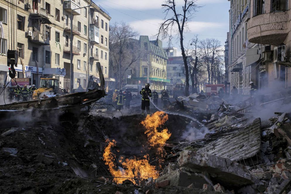 Firefighters extinguish an apartment house after a Russian rocket attack in Kharkiv, Ukraine's second-largest city, Ukraine, Monday, March 14, 2022. (AP Photo/Pavel Dorogoy)