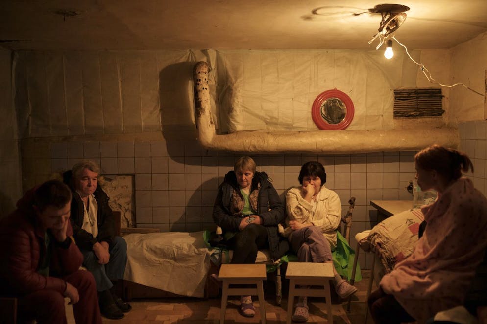 Hospital staff sit in a basement, used as a bomb shelter, during an air raid alarm in Brovary, north of Kyiv, Ukraine, Thursday, March 17, 2022. (AP Photo/Felipe Dana)