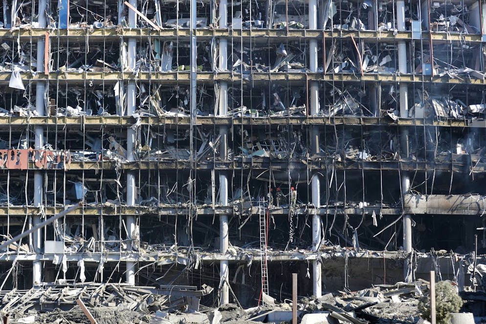 epa09840288 Ukrainian rescuers work at the shopping center that was targeted by Russian attack in Kiev (Kyiv), Ukraine, 21 March 2022. According to emergency service in Kyiv, at least six people died in the Russian bombing on the shopping center. On 24 February Russian troops had entered Ukrainian territory in what the Russian president declared a 'special military operation', resulting in fighting and destruction in the country, a huge flow of refugees, and multiple sanctions against Russia EPA/ATEF SAFADI