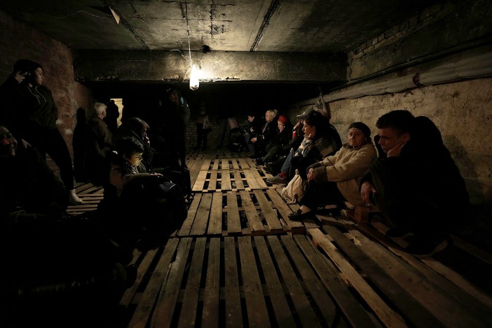 People shelter underground following explosions in Lviv, western Ukraine, Saturday, March 26, 2022. (AP Photo/Nariman El-Mofty)