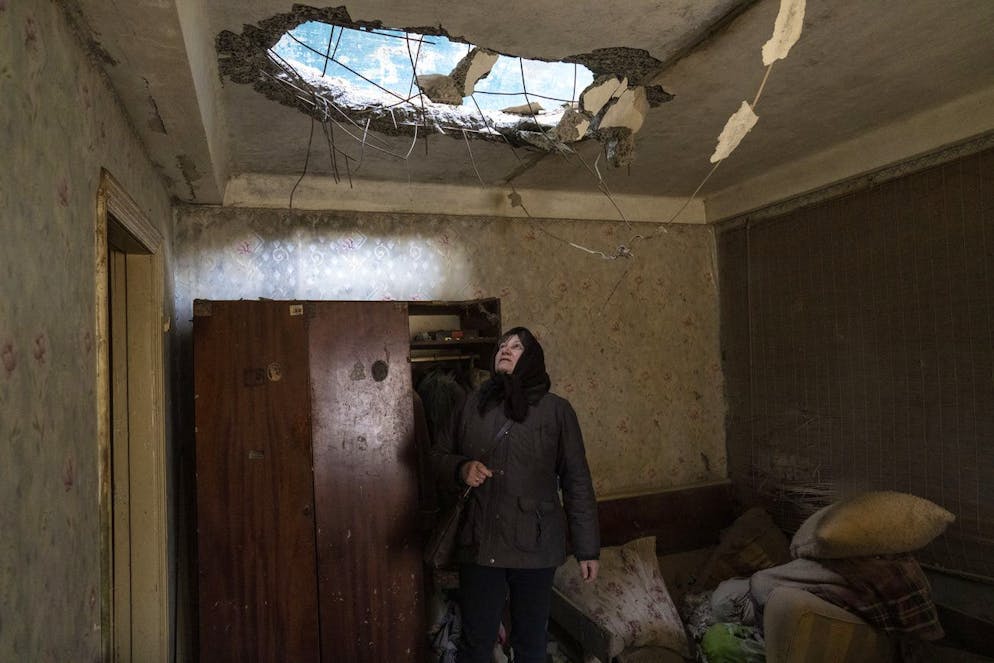Halyna Falko looks at the destruction caused after a Russian attack inside her house near Bravery, on the outskirts of Kyiv, Ukraine, Monday, March 28, 2022. (AP Photo/Rodrigo Abd)