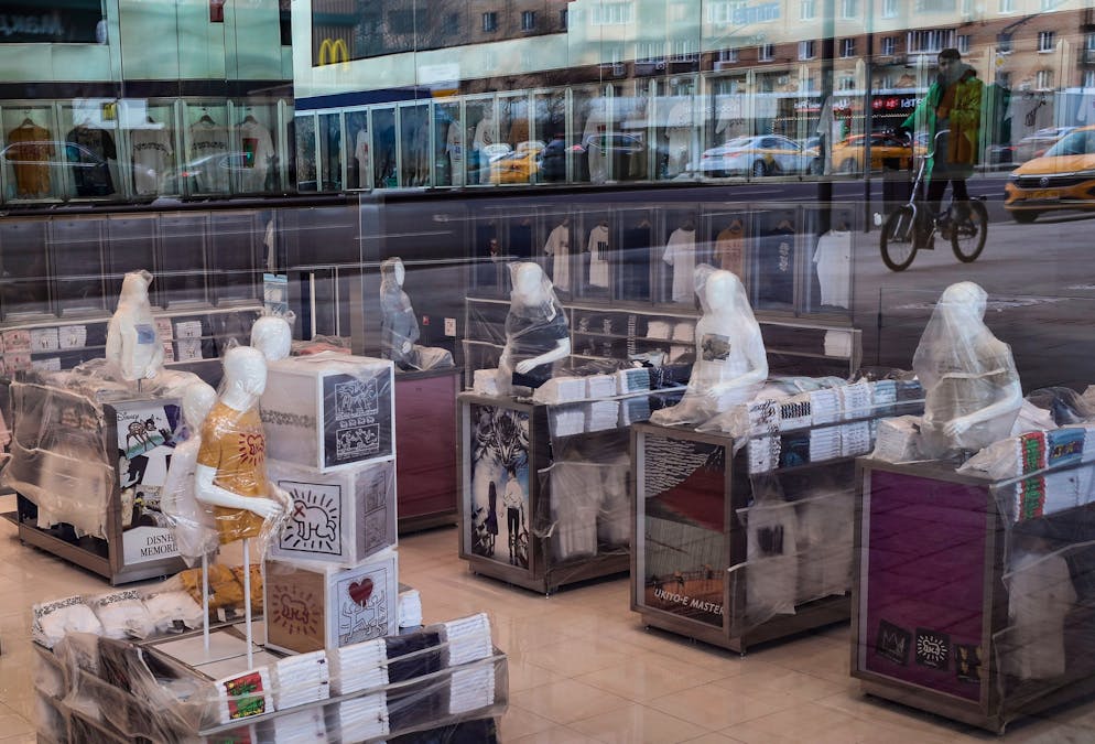 epa09860592 Clothes and mannequins wrapped in plastic inside a closed Uniqlo store in Moscow, Russia, 30 March 2022. Japanese Fast Retailing Co., the operator of the Uniqlo clothing chain, suspended business operations in Russia as a result of sanctions imposed on the country by the international community in the wake of its military operation in Ukraine. The Japanese retailer opened its first store in Russia in 2010 and has 50 stores around the country. EPA/YURI KOCHETKOV