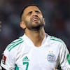Algerias' Riyad Mahrez reacts during the World Cup 2022 qualifying soccer match at the Mustapha Tchaker stadium in Blida, Algeria, Tuesday, March 29, 2022. Cameroon won 2-1 and join Ghana, Senegal, Morocco and Tunisia in representing Africa at the 2022 FIFA World Cup. (AP Photo/Anis Belghoul)