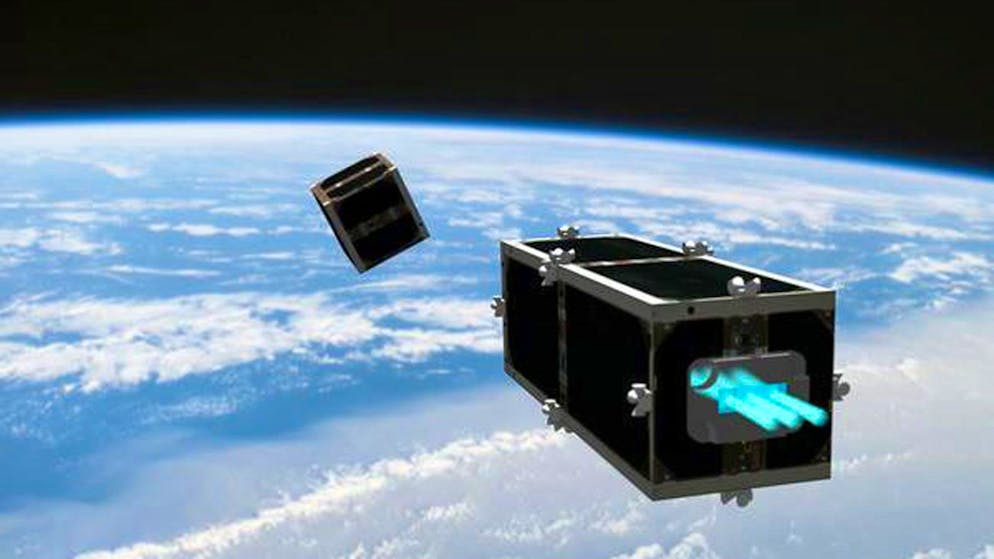 HANDOUT - In this illustration provided by the Swiss Space Center of the Swiss Federal Institute of Technology (EPFL) on Wednesday, February 15, 2012, the CleanSpace One is chasing its target, one of the CubeSats launched by Switzerland in 2009. The EPFL on Wednesday launched the