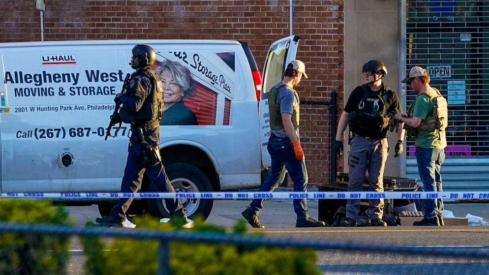 Emergency personnel remove items from a moving van during an ongoing investigation in the Brooklyn borough of New York, Tuesday, April 12, 2022. Multiple people were shot and injured Tuesday at a subway station in New York City during a morning rush hour attack that left wounded commuters bleeding on a train platform. (AP Photo/John Minchillo)