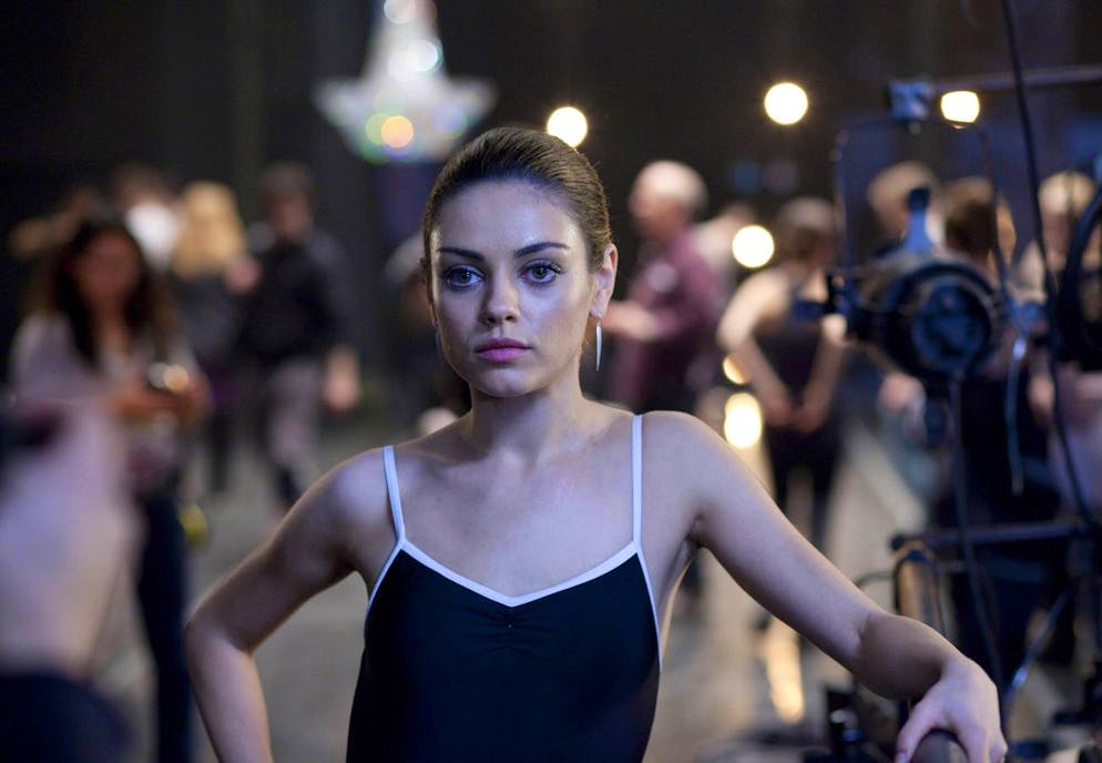 In this film publicity image released by Fox Searchlight, Mila Kunis is shown in a scene from