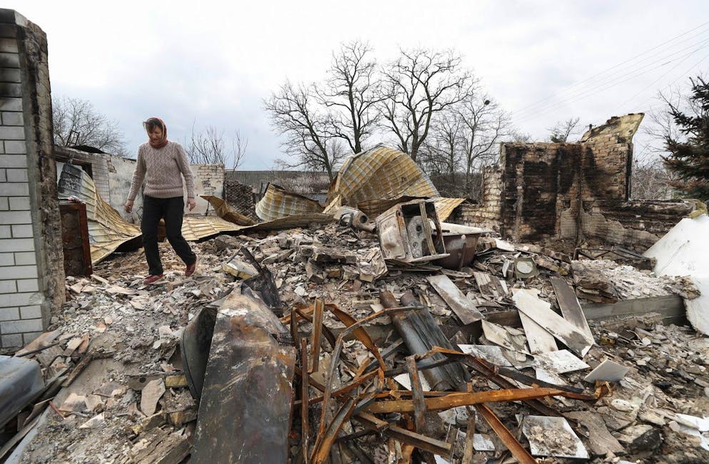 epa09893255 A person walks among the debris of a destroyed building in the aftermath of a shelling in Rusaniv, outskirts of Kyiv (Kiev), Ukraine, 16 April 2022. Russian troops entered Ukraine on 24 February resulting in fighting and destruction in the country, and triggering a series of severe economic sanctions on Russia by Western countries. EPA/SERGEY DOLZHENKO