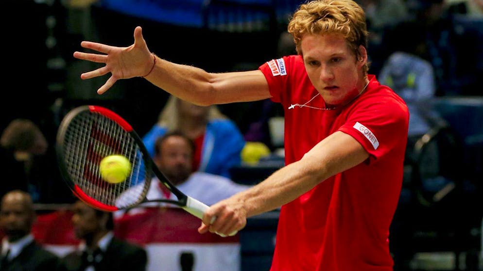 Switzerland's Antoine Bellier returns the ball to United States' Steve Johnson during a Davis Cup tennis match, Sunday, Feb. 5, 2017, in Birmingham, Ala. (AP Photo/Butch Dill)