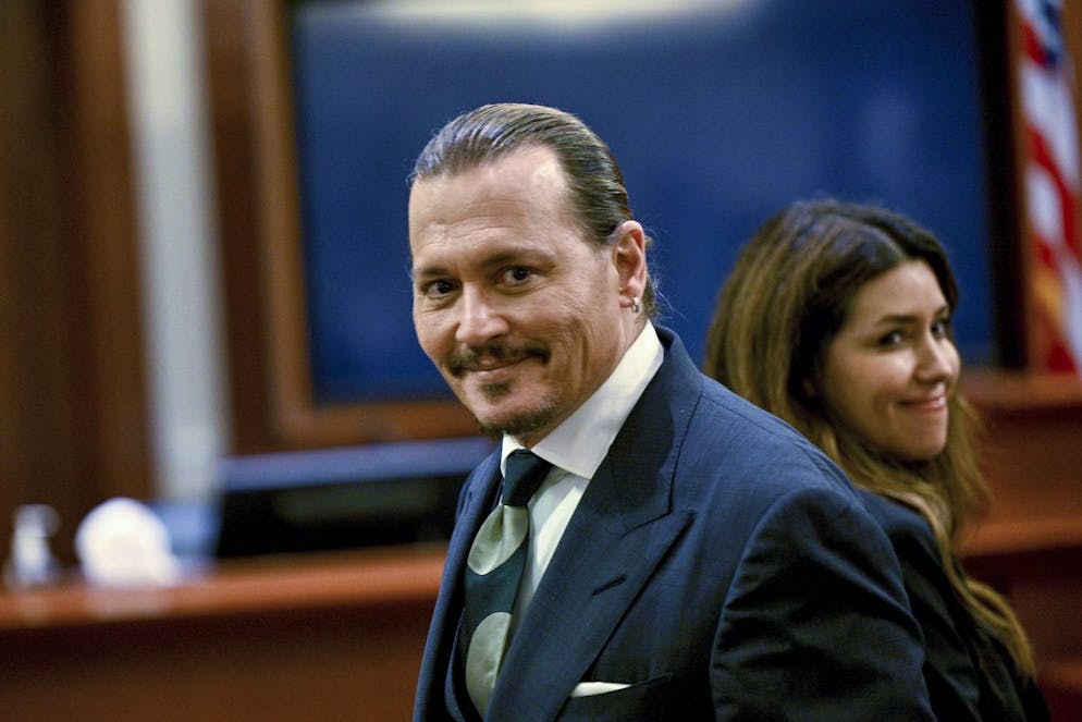 Actor Johnny Depp, left, and his attorney Camille Vasquez appear in the courtroom at the Fairfax County Circuit Court in Fairfax, Va., Tuesday, April 26, 2022. Actor Johnny Depp sued his ex-wife actress Amber Heard for libel in Fairfax County Circuit Court after she wrote an op-ed piece in The Washington Post in 2018 referring to herself as a 