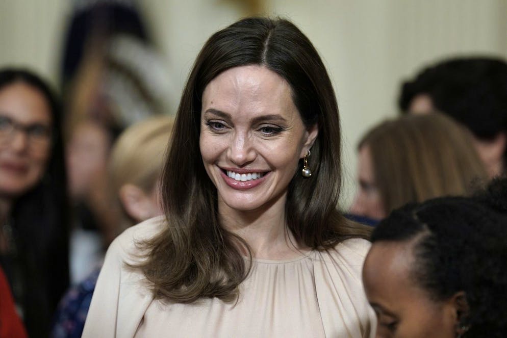 epa09829544 Actress and advocate for victims of domestic abuse Angelina Jolie attends US President Joe Biden's remarks at an event celebrating the reauthorization of the Violence Against Women Act in the East Room of the White House in Washington, DC, USA, 16 March 2022. EPA/SHAWN THEW world rights