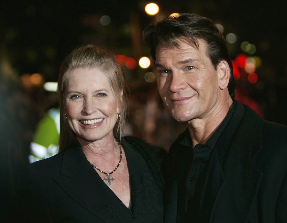 Actress Patrick Swayze, right, accompanied by his wife Lisa, left, pose for the photographers, prior to the premiere of his new film 