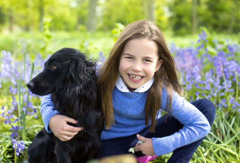 This photo taken during the weekend by BritainâÄ™s Kate, Duchess of Cambridge and released on Sunday, May 1, 2022, shows Britain's Princess Charlotte whose seventh birthday is on Monday, May 2, 2022, with cocker spaniel Orla, in Norfolk, England. (Duchess of Cambridge via AP)