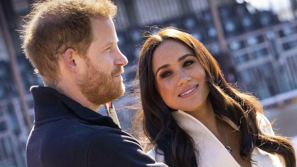 Prince Harry and Meghan Markle, Duke and Duchess of Sussex visit the track and field event at the Invictus Games in The Hague, Netherlands, Sunday, April 17, 2022. The week-long games for active servicemen and veterans who are ill, injured or wounded opened Saturday in this Dutch city that calls itself the global center of peace and justice. (AP Photo/Peter Dejong)