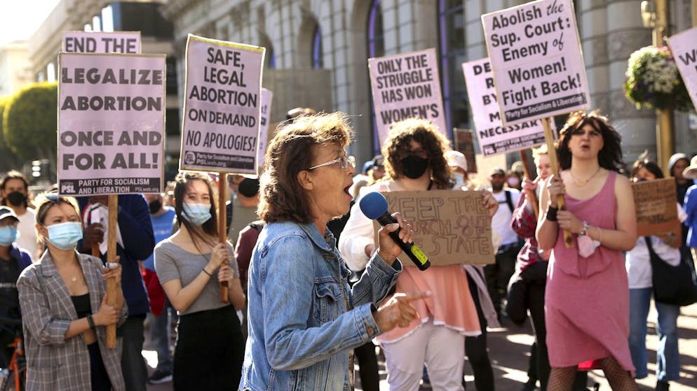 Gloria La Riva speaks during a protest in reaction to a leaked Supreme Court Roe v Wade draft at Powell and Market Streets in San Francisco, on Tuesday, May 3, 2022. (Scott Strazzante/San Francisco Chronicle via AP)