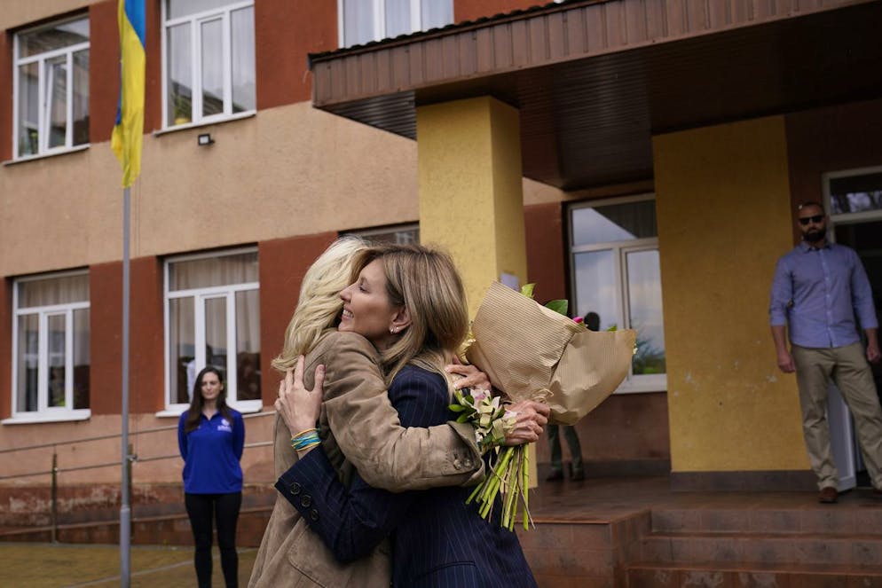 First lady Jill Biden hugs Olena Zelenska, spouse of Ukrainian's President Volodymyr Zelenskyy, outside of School 6, a public school that has taken in displaced students in Uzhhorod, Ukraine, Sunday, May 8, 2022. (AP Photo/Susan Walsh, Pool)