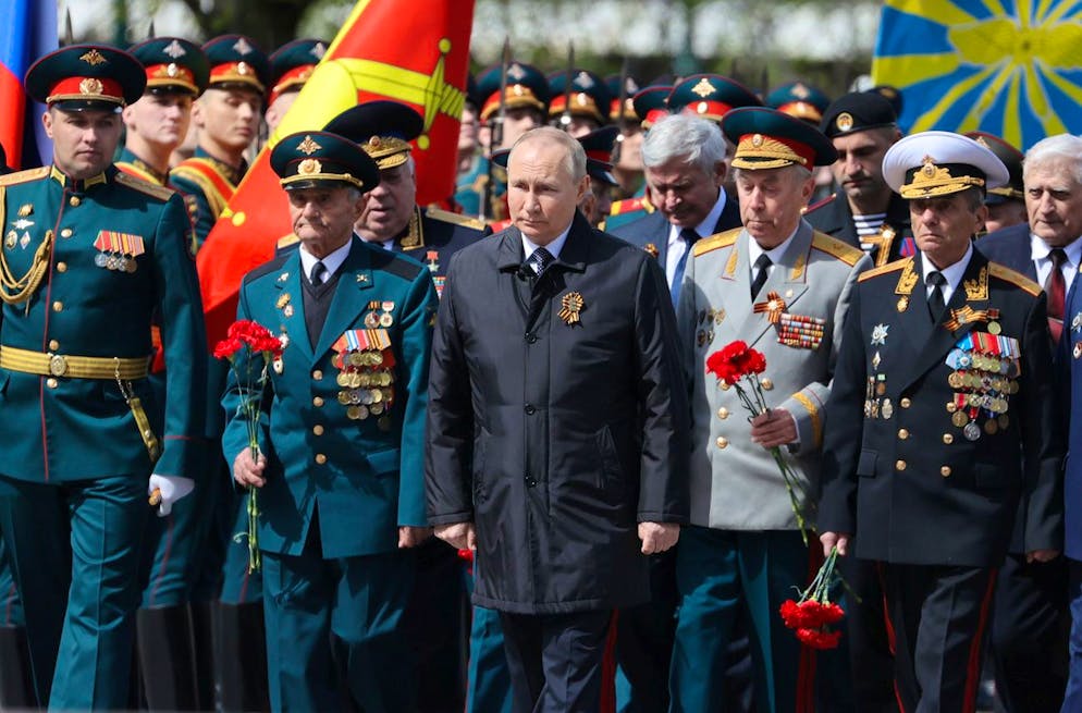Russian President Vladimir Putin, centre, attends a wreath-laying ceremony at the Tomb of the Unknown Soldier after the military parade marking the 77th anniversary of the end of World War II, in Moscow, Russia, Monday, May 9, 2022. (Anton Novoderezhkin, Sputnik, Kremlin Pool Photo via AP)