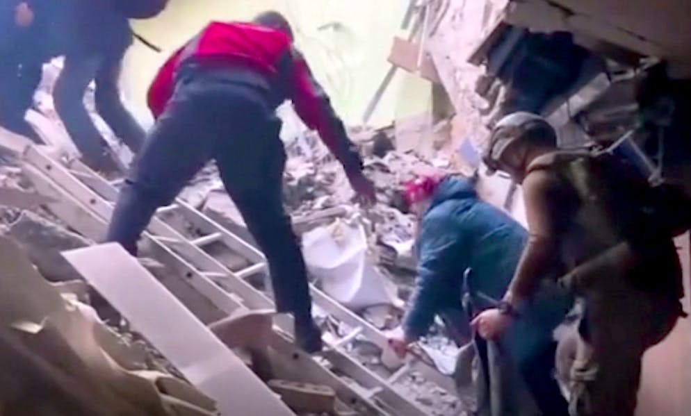 This frame taken from an undated video provided Sunday, May 1, 2022 by the Azov Special Forces Regiment of the Ukrainian National Guard shows people climbing over debris at the Azovstal steel plant, in Mariupol, eastern Ukraine.
As many as 100,000 people may still be in Mariupol, including an estimated 2,000 Ukrainian fighters beneath the sprawling, Soviet-era steel plant — the only part of the city not occupied by the Russians. (Azov Special Forces Regiment of the Ukrainian National Guard via AP)